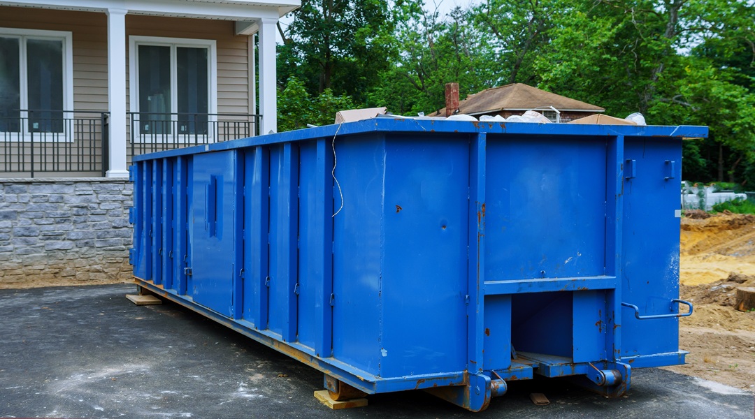 Full construction waste debris a building container, garbage bricks and material from demolished house